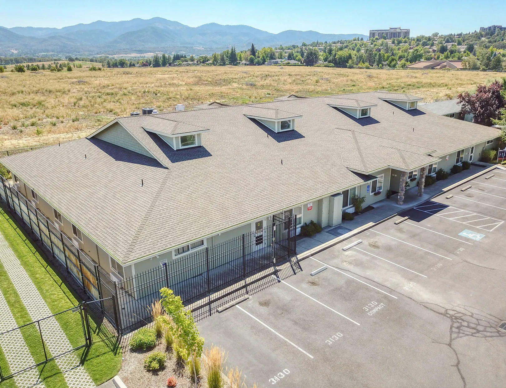 exterior-03 Aerial view of West Wind Assisted Living facility surrounded by open fields and mountains